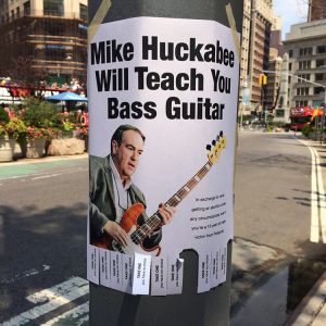 Spotted In NYC: “Mike Huckabee Will Teach You Bass Guitar” Flyers